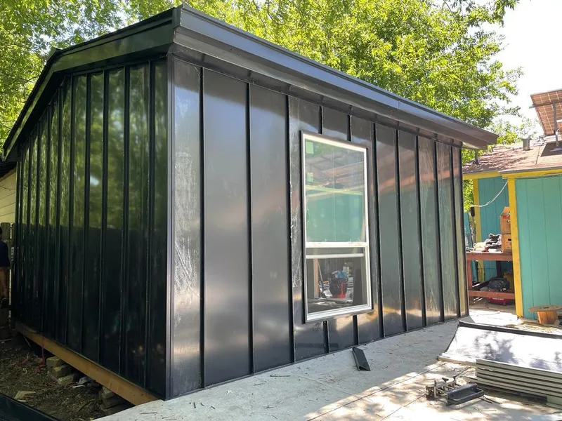 Black standing seam metal wall panels for Roof Inspection in Colby