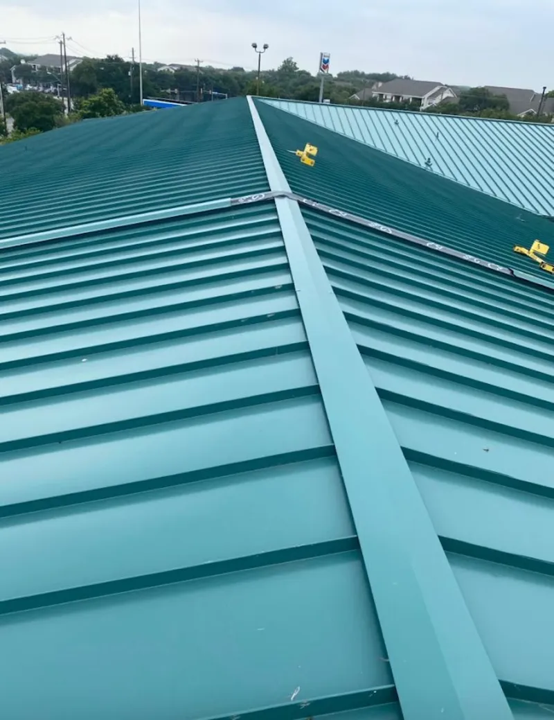Green commercial metal roof ridge and valley for Metal Roof Repair in Colby